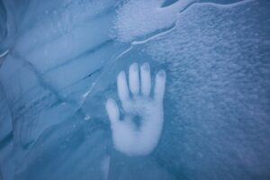 Human Hand Imprint on the Ice Wall in the Natural Cave